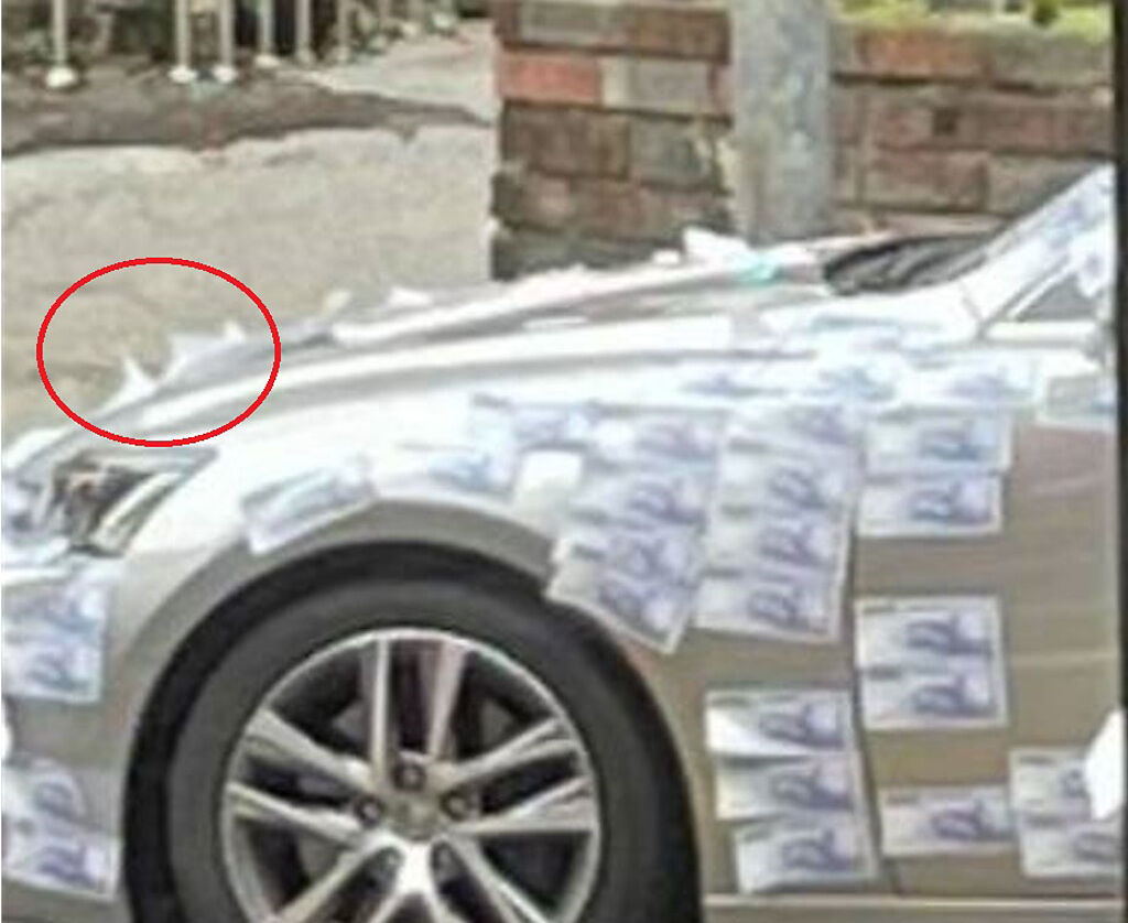 男子看見貼滿「千元鈔」轎車，網有放大照片看見紙鈔背面白的，認為根本是貼玩具鈔。（翻攝自臉書爆廢公社）