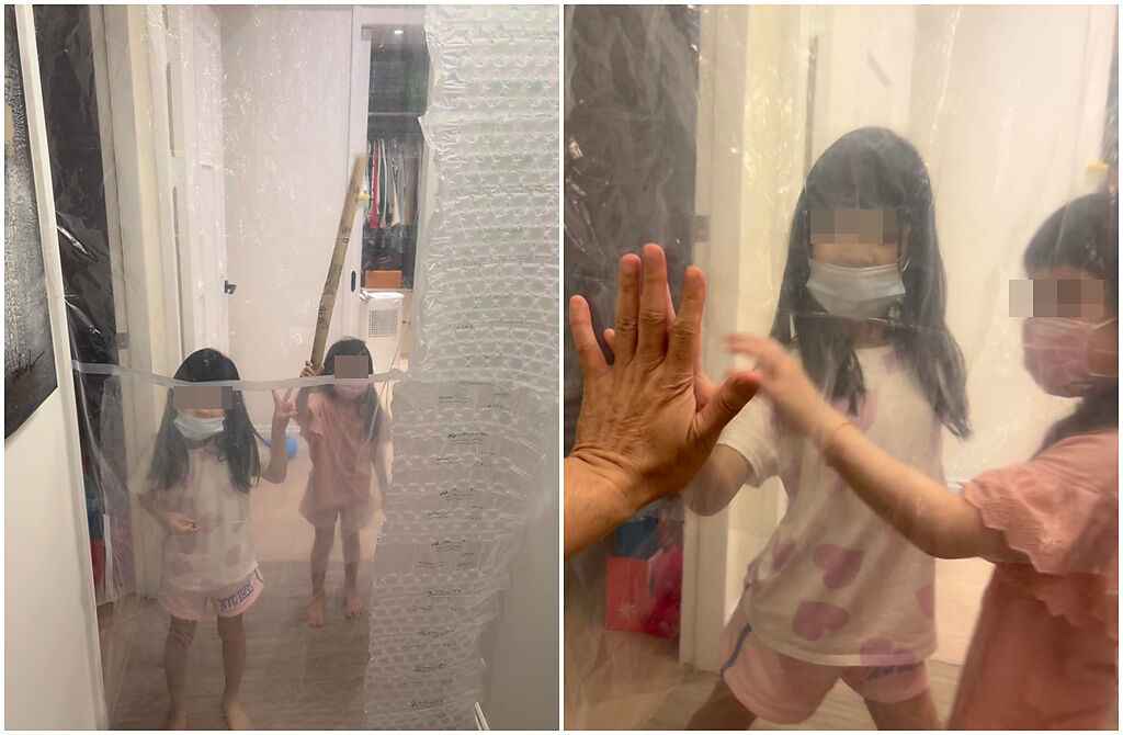 伊正只能隔著塑膠帷幕和兩個女兒對望。(伊正臉書)